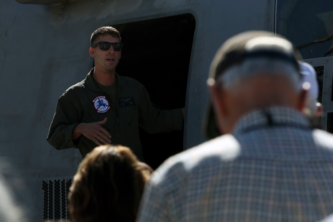 1st Lt. Cory Ferns, an MV-22B Osprey pilot with Marine Medium Tiltrotor Squadron (VMM) 162, explains the purpose of the MV-22B to members of the U.S. Naval Academy Alumni Association at Marine Corps Air Station Miramar, Calif., Oct. 26. Members of the U.S. Naval Academy Alumni Association visited MCAS Miramar to get an idea of what it’s like to be stationed at MCAS Miramar (U.S. Marine Corps photo by Sgt. Jake McClung)