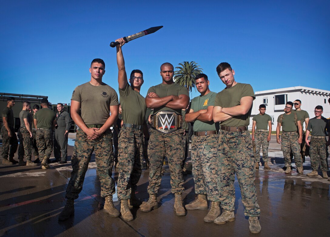 Marines with aviation ordnance Headquarters and Headquarters Squadron (H&HS), pose with the warrior challenge trophies after winning the event at Marine Corps Air Station Miramar, Calif., Nov. 26. The warrior challenge is held every month by H&HS to build unit cohesion and boost morale through various unit competitions. (U.S. Marine Corps photo by Cpl. Becky Cleveland)