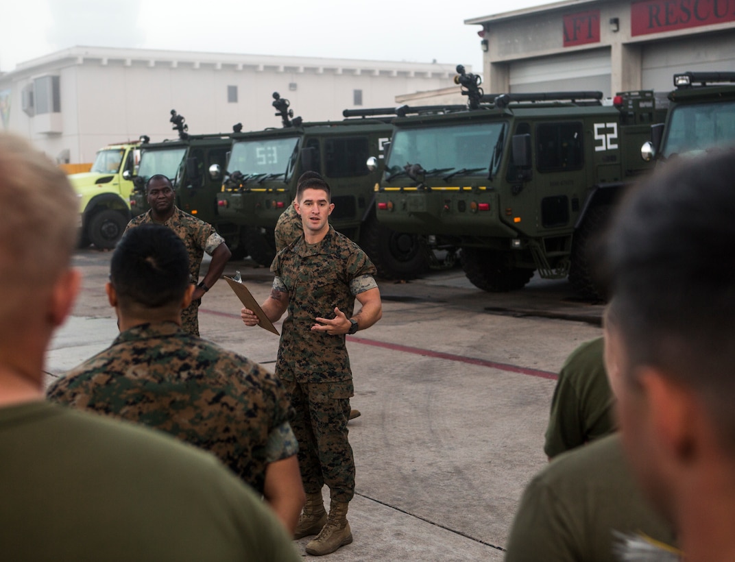 Marines receive instructions from Staff Sgt. Ryan D. Gunity, health and safety officer with aircraft rescue and firefighting, Headquarters and Headquarters Squadron (H&HS), prior to starting the warrior challenge at Marine Corps Air Station Miramar, Calif., Nov. 26. The warrior challenge is held every month by H&HS to build unit cohesion and boost morale through various unit competitions. (U.S. Marine Corps photo by Cpl. Becky Cleveland)