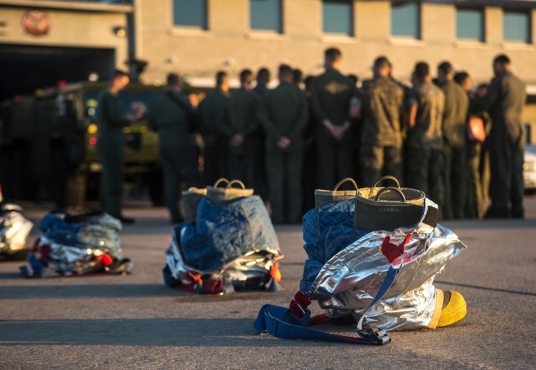 Marines stand by to receive instructions prior to starting the warrior challenge at Marine Corps Air Station Miramar, Calif., Nov. 26. The warrior challenge is held every month by Headquarters and Headquarters Squadron to build unit cohesion and boost morale through various unit competitions. (U.S. Marine Corps photo by Cpl. Becky Cleveland)