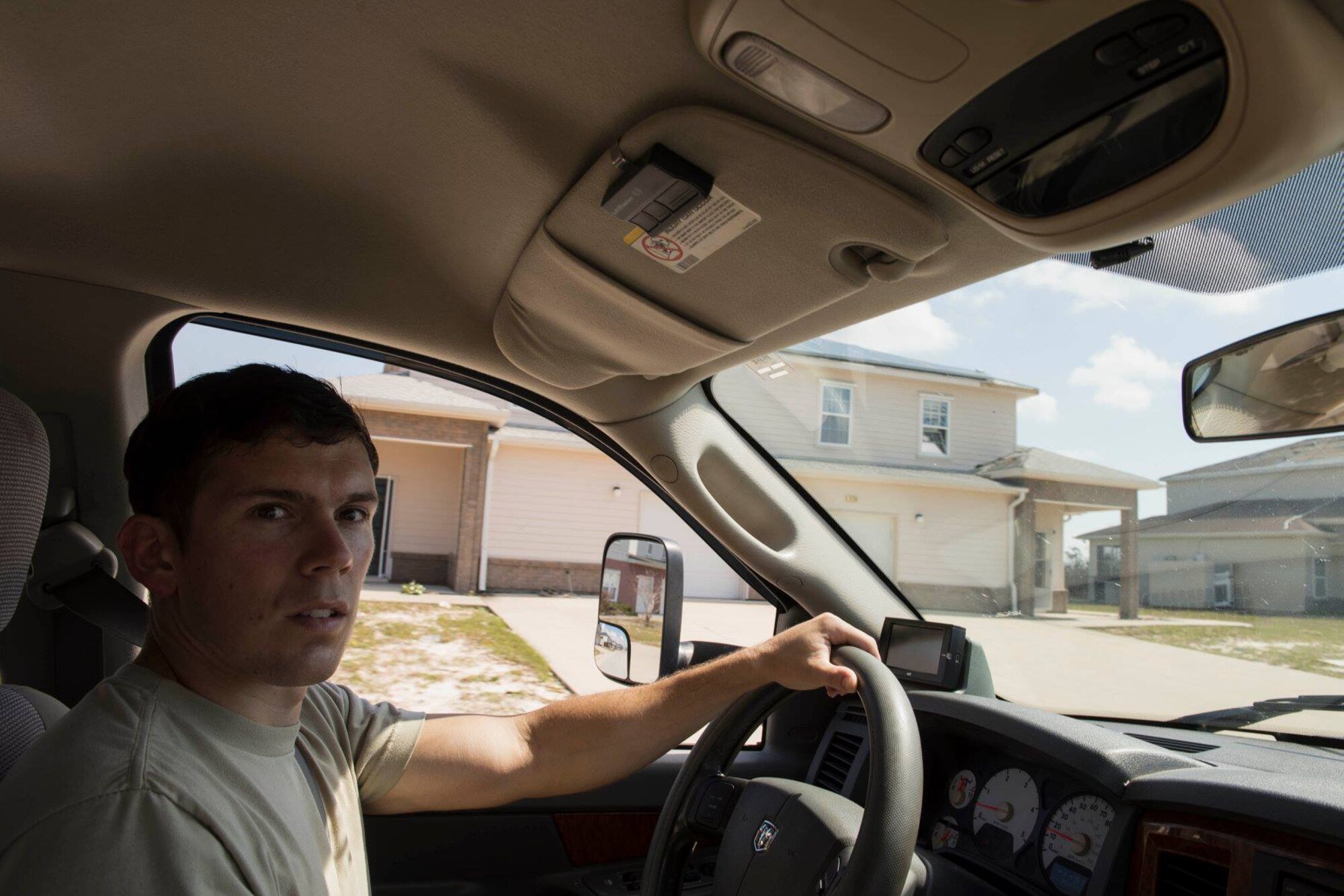 1st Lt. Adam Kriete, 337th Air Control Squadron student, drives through his neighborhood to inspect damage, at Tyndall Air Force Base, Fla., Oct. 19, 2018. Tyndall AFB was damaged by Hurricane Michael which displaced approximately 11,000 people, to include the Kriete family who travelled back to Tyndall during a five hour window to recover their belongings.