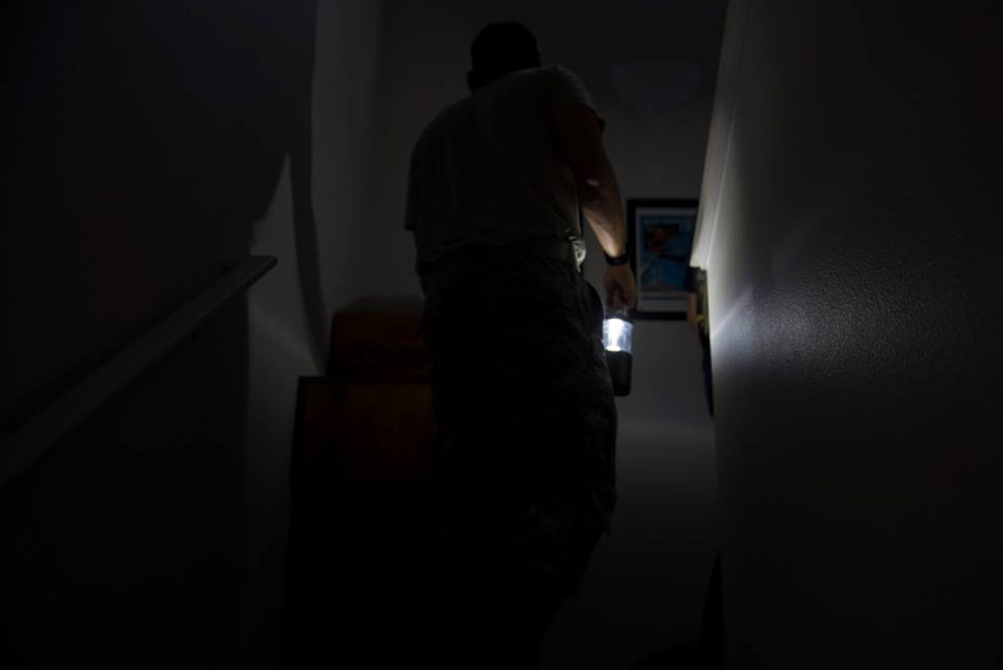 1st Lt. Adam Kriete, 337th Air Control Squadron student, searches for personal items in his home, at Tyndall Air Force Base, Fla., Oct. 19, 2018. Tyndall AFB was damaged by Hurricane Michael which displaced approximately 11,000 people, to include the Kriete family who travelled back to Tyndall during a five hour window to recover their belongings.