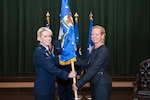 U.S. Air Force Brig. Gen. Laura L. Lenderman, 502d Air Base Wing and Joint Base San Antonio commander, presents the 502d Civil Engineer Group guidon to Brenda L.  Roesch as she takes command during an activation ceremony Oct. 25, 2018, at Joint Base San Antonio-Lackland, Texas.
