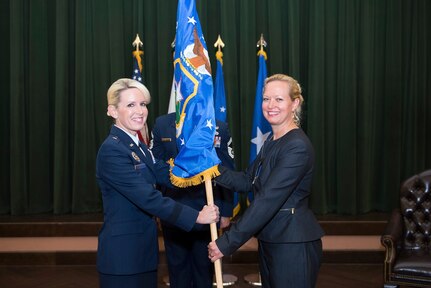 U.S. Air Force Brig. Gen. Laura L. Lenderman, 502d Air Base Wing and Joint Base San Antonio commander, presents the 502d Civil Engineer Group guidon to Brenda L.  Roesch as she takes command during an activation ceremony Oct. 25, 2018, at Joint Base San Antonio-Lackland, Texas.