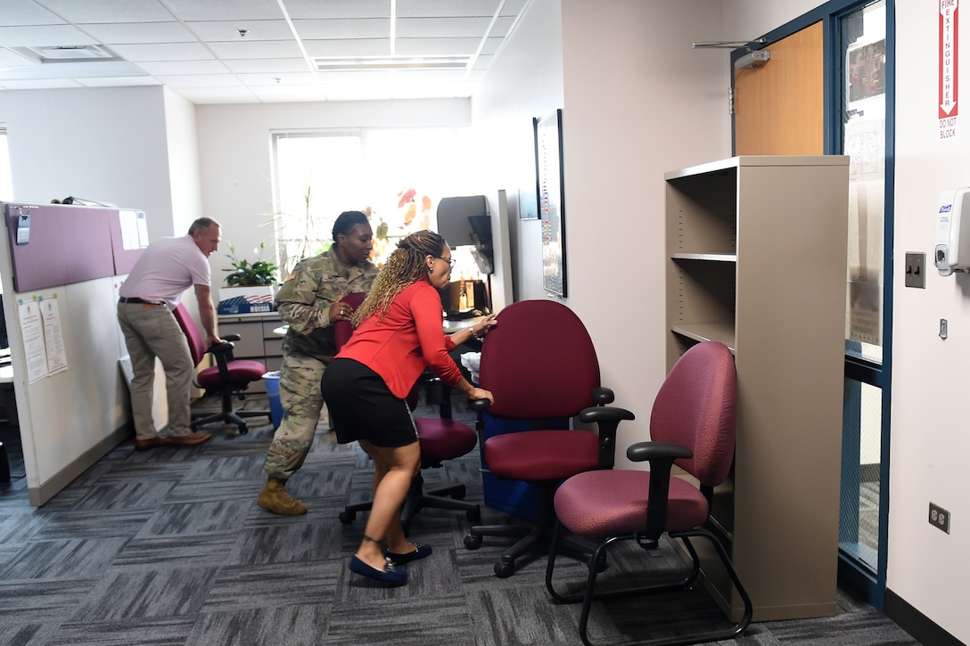 Army Reserve Soldiers and staff members barricade a main doorway during an active shooter training exercise at the command headquarters, Oct. 30, 2018.