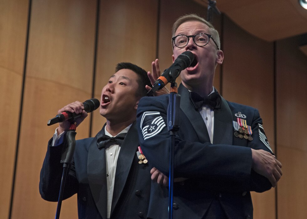 Master Sgt. Benjamin Park, left, and Senior Master Sgt. Ryan Dolan, right, U.S. Air Force Band’s Singing Sergeants vocalists, perform at the I.M. Terrell Academy in Fort Worth, Texas, Oct. 26, 2018. The band aims to inspire patriotism and service, as well as honor veterans. (U.S. Air Force photo by Senior Airman Abby L. Richardson)