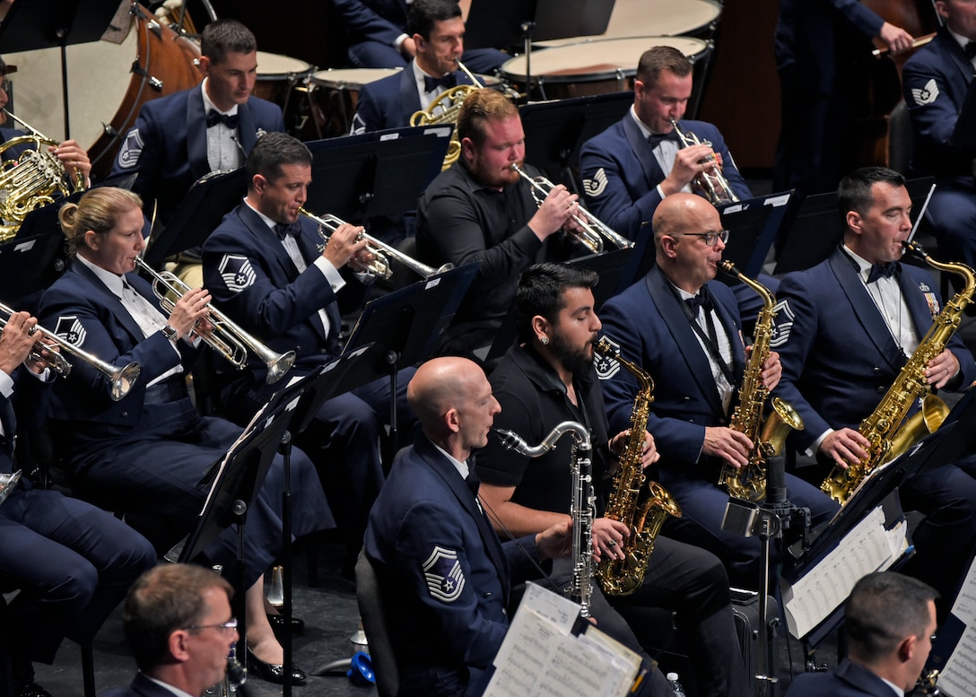 Members of the U.S. Air Force Band perform alongside University of Texas Permian Basin band students at the Wagner Noël Performing Arts Center in Midland, Texas, Oct. 21, 2018. The band aims to inspire patriotism and service, as well as honor veterans. (U.S. Air Force photo by Senior Airman Abby L. Richardson)