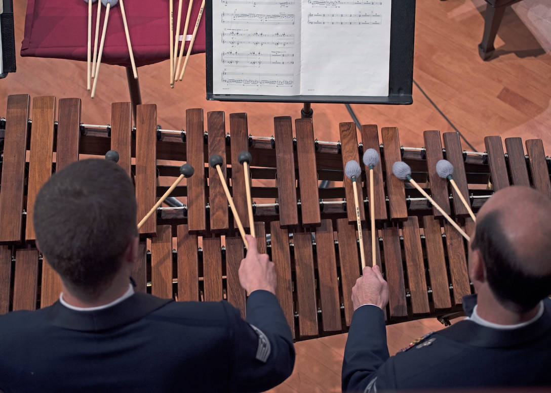 Tech. Sgt. Matt Penland, left, and Master Sgt. Marc Dinitz, right, U.S. Air Force Band percussionists, play the marimba during a performance at the University of North Texas in Denton, Texas, Oct. 25, 2018. The band performed in locations across New Mexico and Texas to inspire and engage the local communities. (U.S. Air Force photo by Senior Airman Abby L. Richardson)