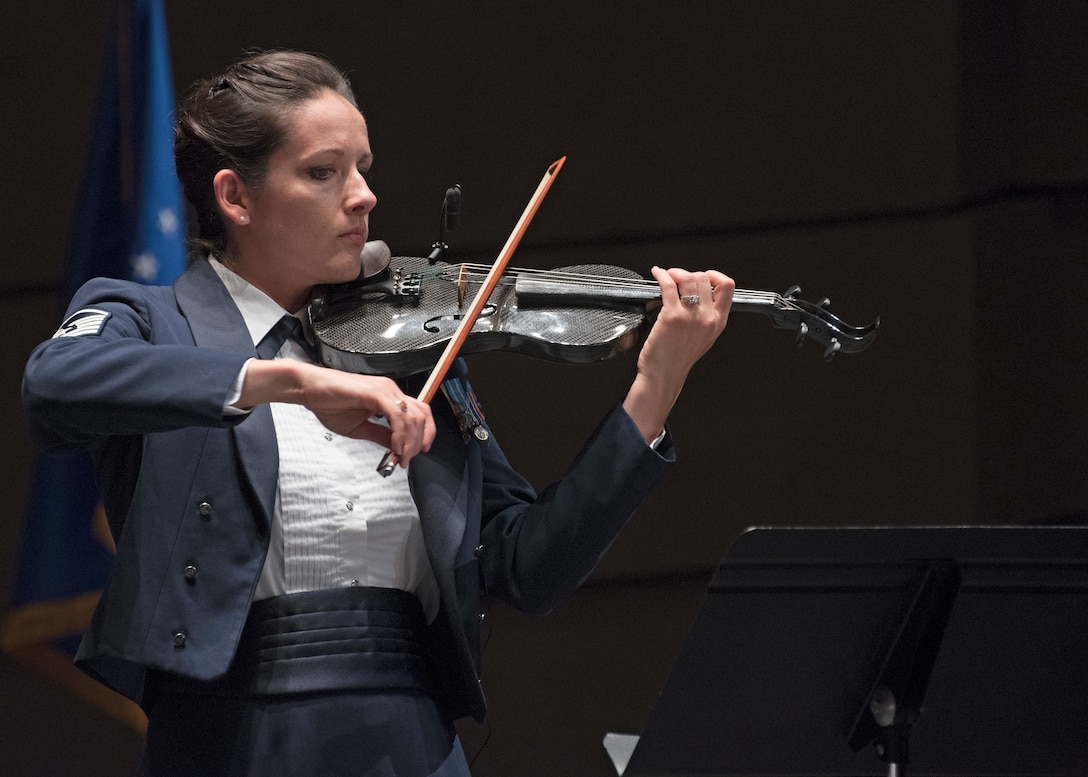 Master Sgt. Emily Wellington, U.S. Air Force Band’s Singing Sergeants vocalist and violinist, performs at the Wagner Noël Performing Arts Center in Midland, Texas, Oct. 21, 2018. The band aims to inspire patriotism and service, as well as honor veterans. (U.S. Air Force photo by Senior Airman Abby L. Richardson)