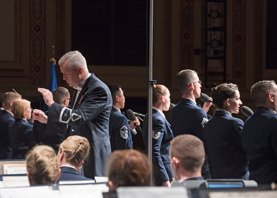 Col. Larry H. Lang, U.S. Air Force Band commander and conductor, leads the band and Singing Sergeants during a performance at the San Angelo Performing Arts Center in San Angelo, Texas, Oct. 22, 2018. The band performed in 12 locations across New Mexico and Texas. (U.S. Air Force photo by Senior Airman Abby L. Richardson)