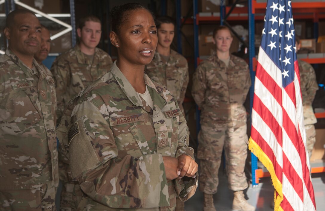 Chief Master Sgt. Anitra Nesbitt, 379th Expeditionary Logistics Readiness Squadron materiel management flight chief, thanks Airmen of the 379th ELRS for their hard work during a ribbon cutting ceremony commemorating the grand opening of the new Desert Depot Oct. 30, 2018, at Al Udeid Air Base, Qatar. The ceremony completes a two-year effort to relocate to a $1.1 million facility. Airmen of the 379th ELRS pulled together to move 42,000 assets to the new location during a four-day period. (U.S. Air Force photo by Tech. Sgt. Christopher Hubenthal)