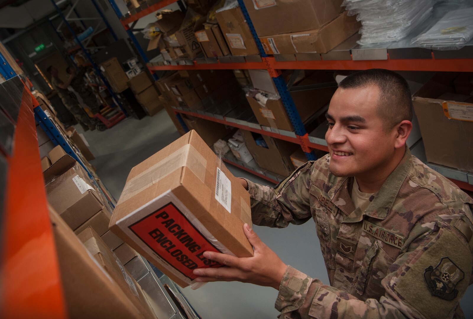 Staff Sgt. Mario Lopez, 379th Expeditionary Logistics Readiness Squadron materiel management craftsman, organizes boxes at the newly relocated Desert Depot Oct. 30, 2018, at Al Udeid Air Base, Qatar. The 379th ELRS recently relocated the Desert Depot, celebrating the moves completion during a ribbon cutting ceremony. The ceremony completes a two-year effort to relocate to a $1.1 million facility. Airmen of the 379th ELRS pulled together to move 42,000 assets to the new location during a four-day period. (U.S. Air Force photo by Tech. Sgt. Christopher Hubenthal)