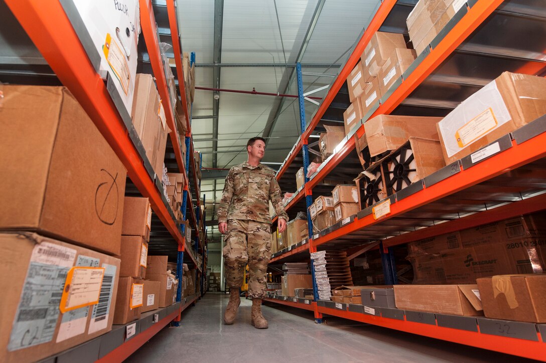 Airman 1st Class Dustin Marin, 379th Expeditionary Logistics Readiness Squadron materiel management technician, organizes assets at the newly relocated Desert Depot Oct. 30, 2018, at Al Udeid Air Base, Qatar. The 379th ELRS recently relocated the Desert Depot, celebrating the moves completion during a ribbon cutting ceremony. The ceremony culminates a two year effort to relocate to a $1.1 million facility. Airmen of the 379th ELRS pulled together to move 42,000 assets to the new location during a four-day period. (U.S. Air Force photo by Tech. Sgt. Christopher Hubenthal)