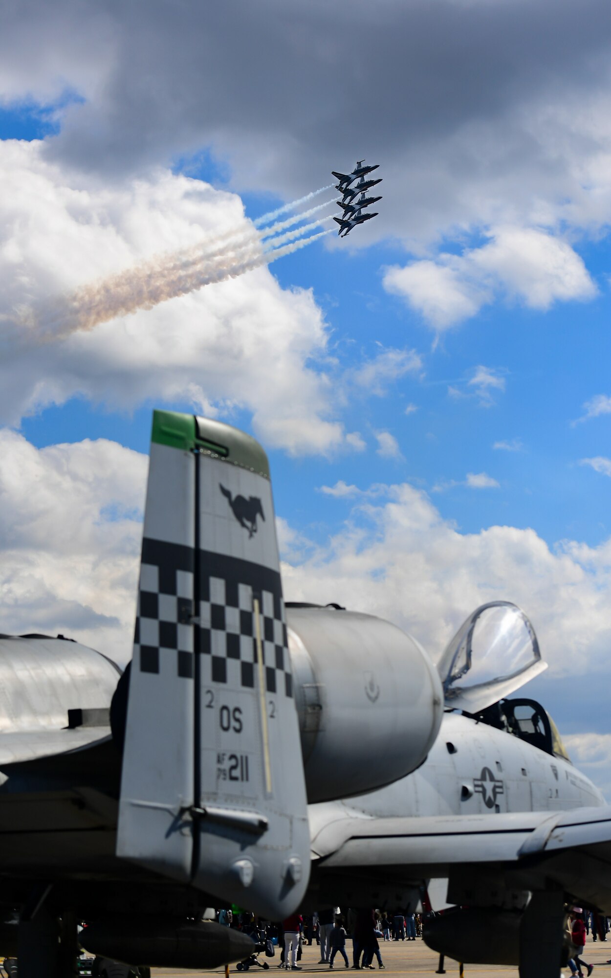 The Republic of Korea’s 53rd Demonstration Group, also known as the Black Eagles, fly above an A-10 Thunderbolt II as they perform at the Gyeongnam Sacheon Aerospace Expo at Sacheon Air Base, South Korea, Oct. 25, 2018.