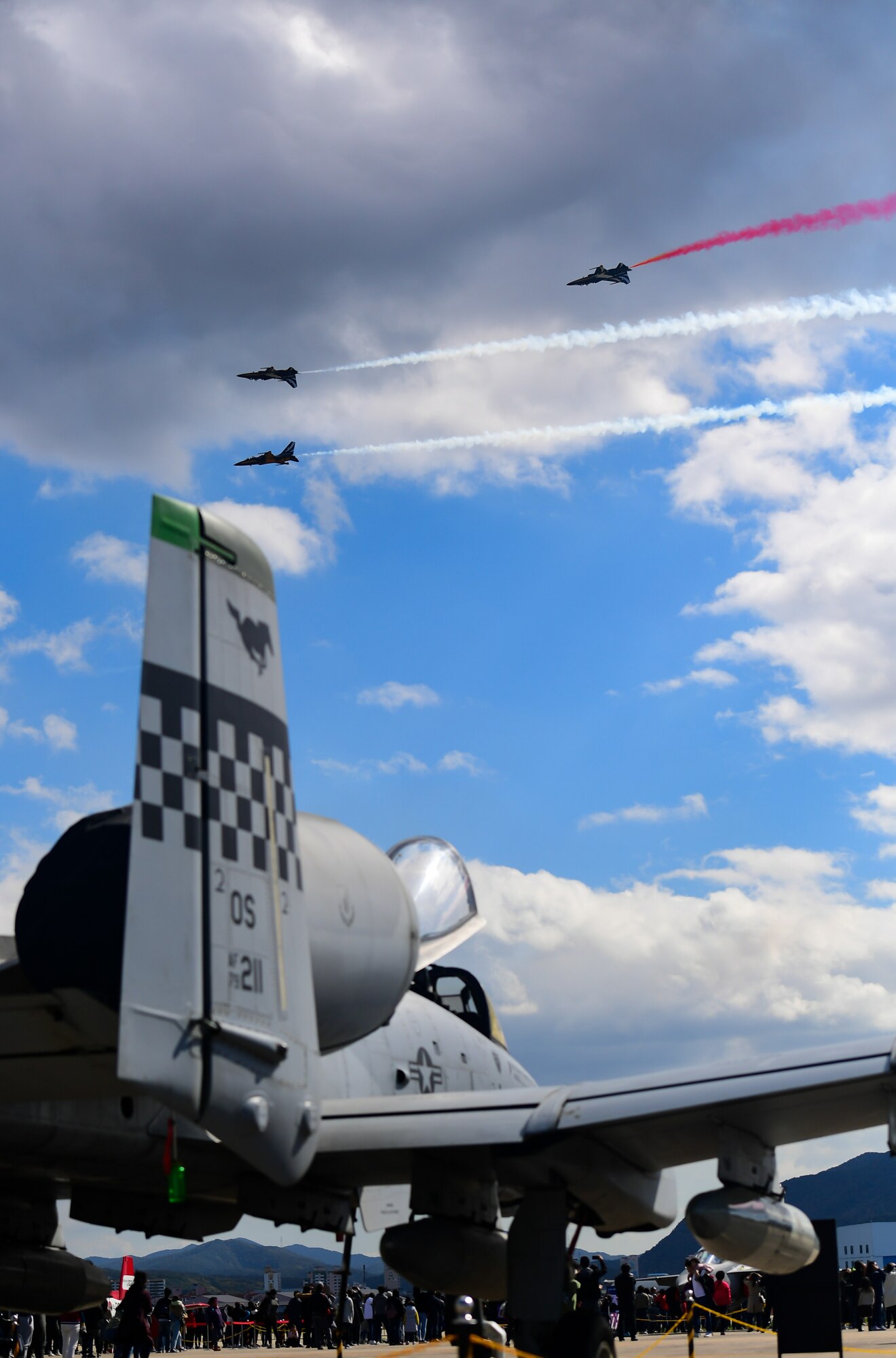 The Republic of Korea’s 53rd Demonstration Group, also known as the Black Eagles, fly above an A-10 Thunderbolt II as they perform at the Gyeongnam Sacheon Aerospace Expo at Sacheon Air Base, South Korea, Oct. 25, 2018.