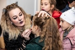 Spc. Kristina Brown of the 278th ACR face paints during the Trick or Treat Halloween event at the Yavoriv Combat Training Center, Ukraine, Oct. 27, 2018.