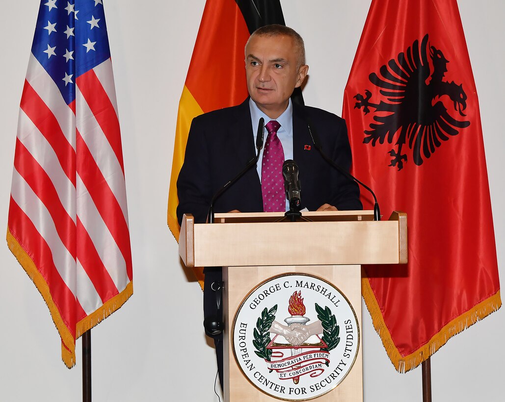 Albanian President Ilir Meta speaks from behind a podium.