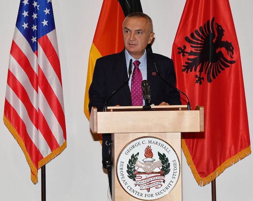 Albanian President Ilir Meta speaks from behind a podium.