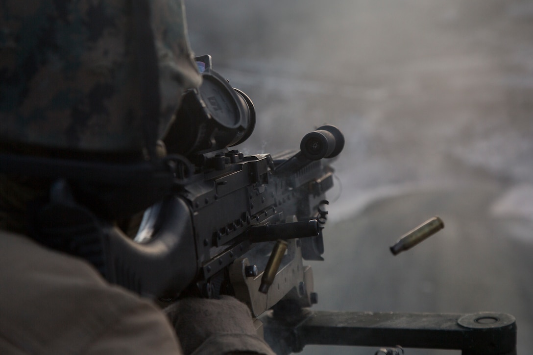 A U.S. Marine with Marine Rotational Force-Europe 19.1 fires the M240B machine gun of an AAV-P7/A1 assault amphibious vehicle during Exercise Northern Screen at Setermoen, Norway, Oct. 28, 2018. The purpose of the exercise is to increase Marine’s proficiency in cold-weather, artic, and mountainous environments.