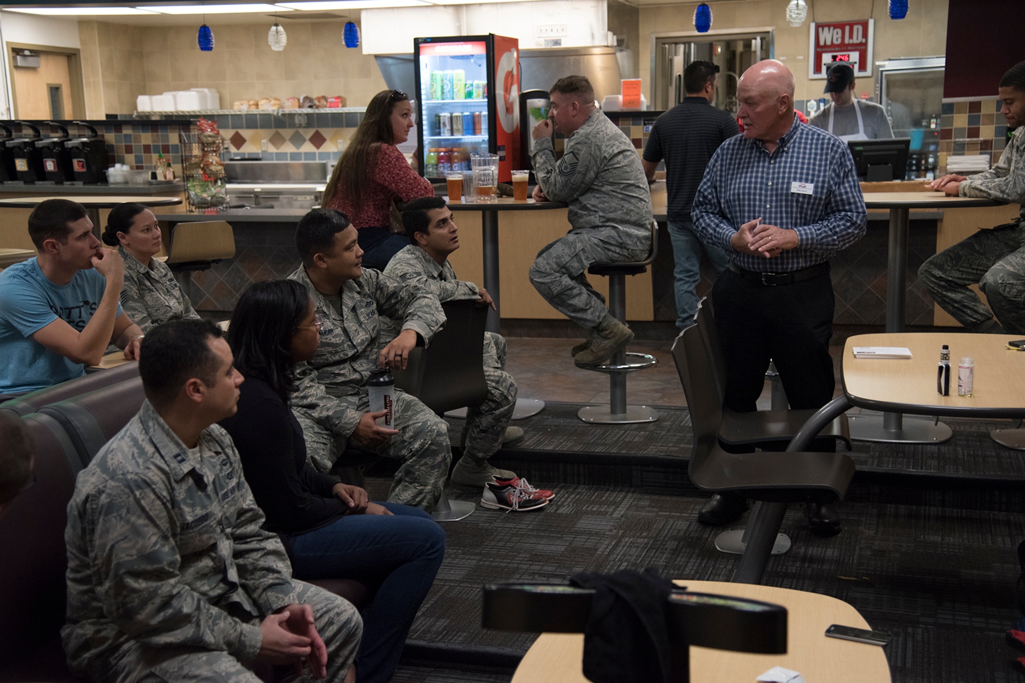 Michael James, Veterans Squaring Away Veterans executive vice president, speaks with Airmen about the Combined Federal Campaign at the bowling alley on Peterson Air Force Base, Colorado, Oct. 19, 2018.