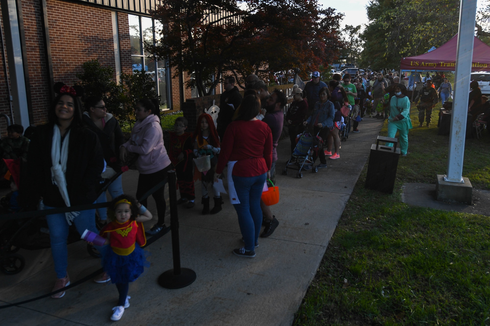 Community members wait for the Night at the Transportation Museum event at the U.S. Army Transportation Museum at Joint Base Langley-Eustis, Virginia, Oct. 29, 2018. Volunteers dressed in U.S. Army uniforms from different time periods and passed out candy in exhibits decorated for Halloween. (U.S. Air Force photo by Senior Airman Derek Seifert)