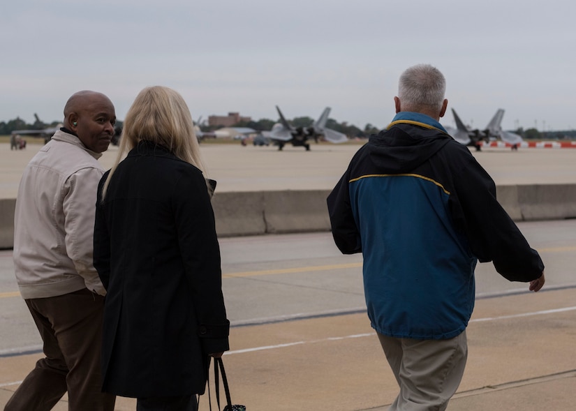 Academy of Hampton teachers walk on the flight line during a tour of the 1st Maintenance Group facilities at Joint Base Langley-Eustis, Virginia, Oct. 26, 2018.
