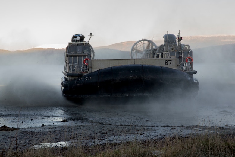 A landing craft air cushion lands on Alvund Beach, Norway during an amphibious landing in support of Trident Juncture 18, Oct. 29, 2018. Trident Juncture provides a unique environment for the Marines and Sailors to rehearse their amphibious capabilities. The LCACs originated from USS Iwo Jima (LHD 7) and showcased the ability of the Iwo Jima Amphibious Ready Group and the 24th Marine Expeditionary Unit to rapidly project combat power ashore. (U.S. Marine Corps photo by Lance Cpl. Margaret Gale)