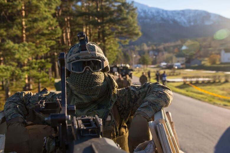 Lance Cpl. Anthony Cardella prepares for a convoy during Trident Juncture 18, Oct. 29, 2018. Marines and equipment with the 24th Marine Expeditionary Unit were rapidly projected ashore from USS Iwo Jima (LHD 7) during an amphibious landing. Trident Juncture exercises tactics and procedures in different environments which enables forces to increase readiness and improve interoperability with international partners and allies. Cardella is a machine gunner with 2nd Battalion, 2nd Marine Regiment, 24th MEU. (U.S. Marine Corps photo by lance Cpl. Margaret Gale)