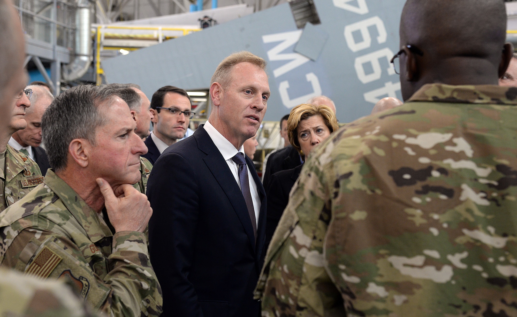 Deputy Secretary of Defense Patrick Shanahan (center) and Chief of Staff of the Air Force David Goldfein (left) learn more about the Ogden Air Logistics Complex during a tour from Maj. Gen. Stacey Hawkins, OO-ALC commander.