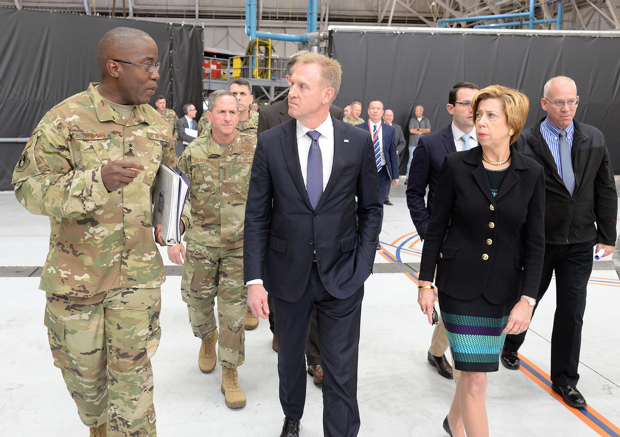 Maj. Gen. Stacey Hawkins, Ogden Air Logistics Complex commander, briefs Deputy Secretary of Defense Patrick Shanahan during a tour of the ALC facility.