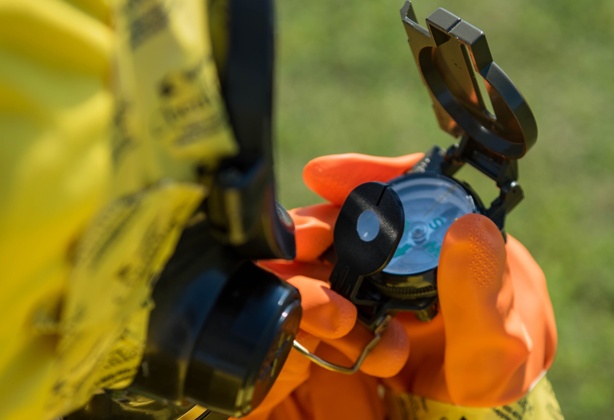 A U.S. Air Force Airman assigned to the 633rd Civil Engineer Squadron uses a compass during a joint radiological response training at Joint Base Langley-Eustis, Virginia, Oct. 3, 2018.