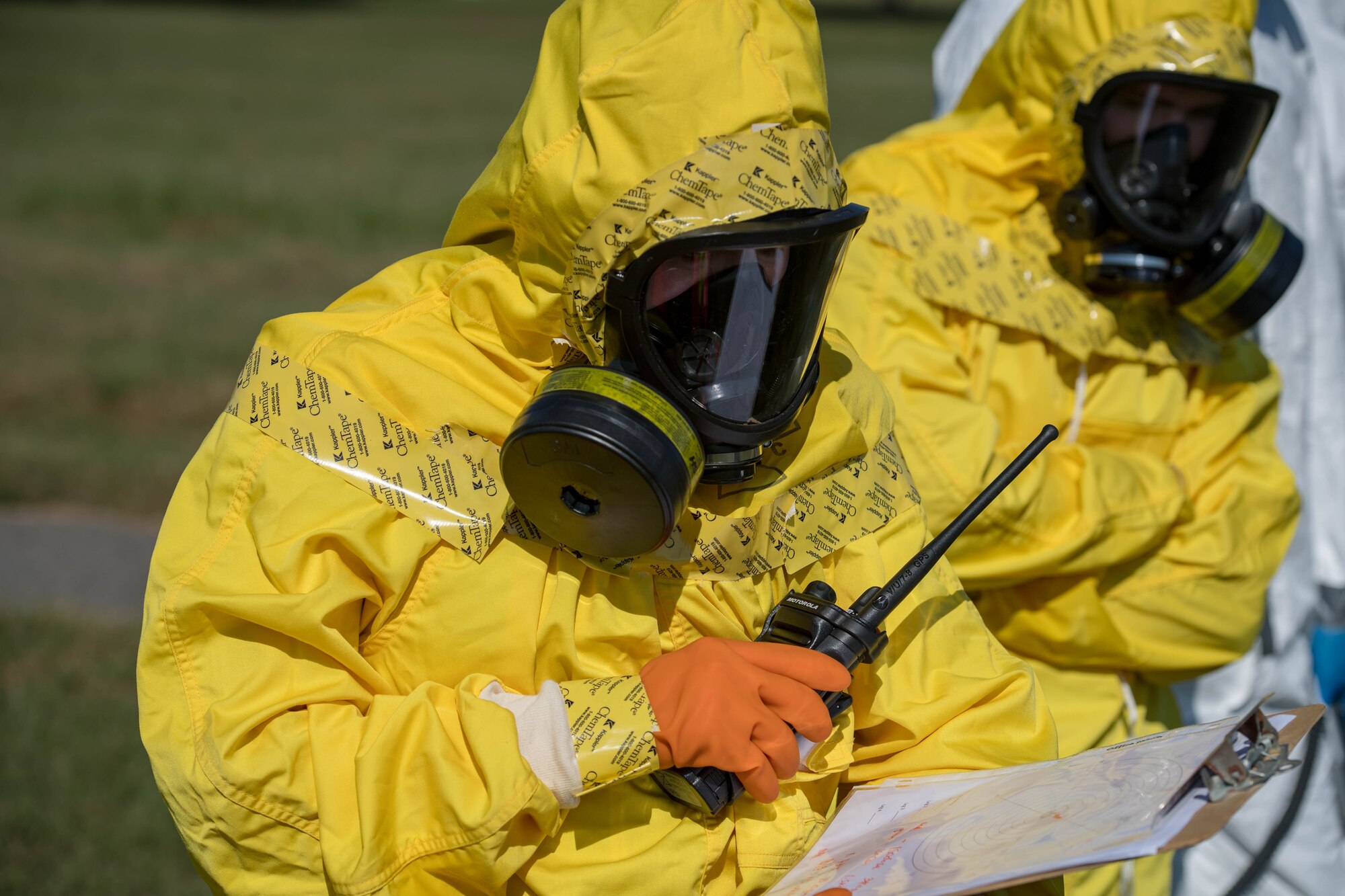 U.S. Air Force Airmen assigned to the 633rd Civil Engineer Squadron and the 633rd Aerospace Medicine Squadron report their findings during a joint radiological response training at Joint Base Langley-Eustis, Virginia, Oct. 3, 2018.