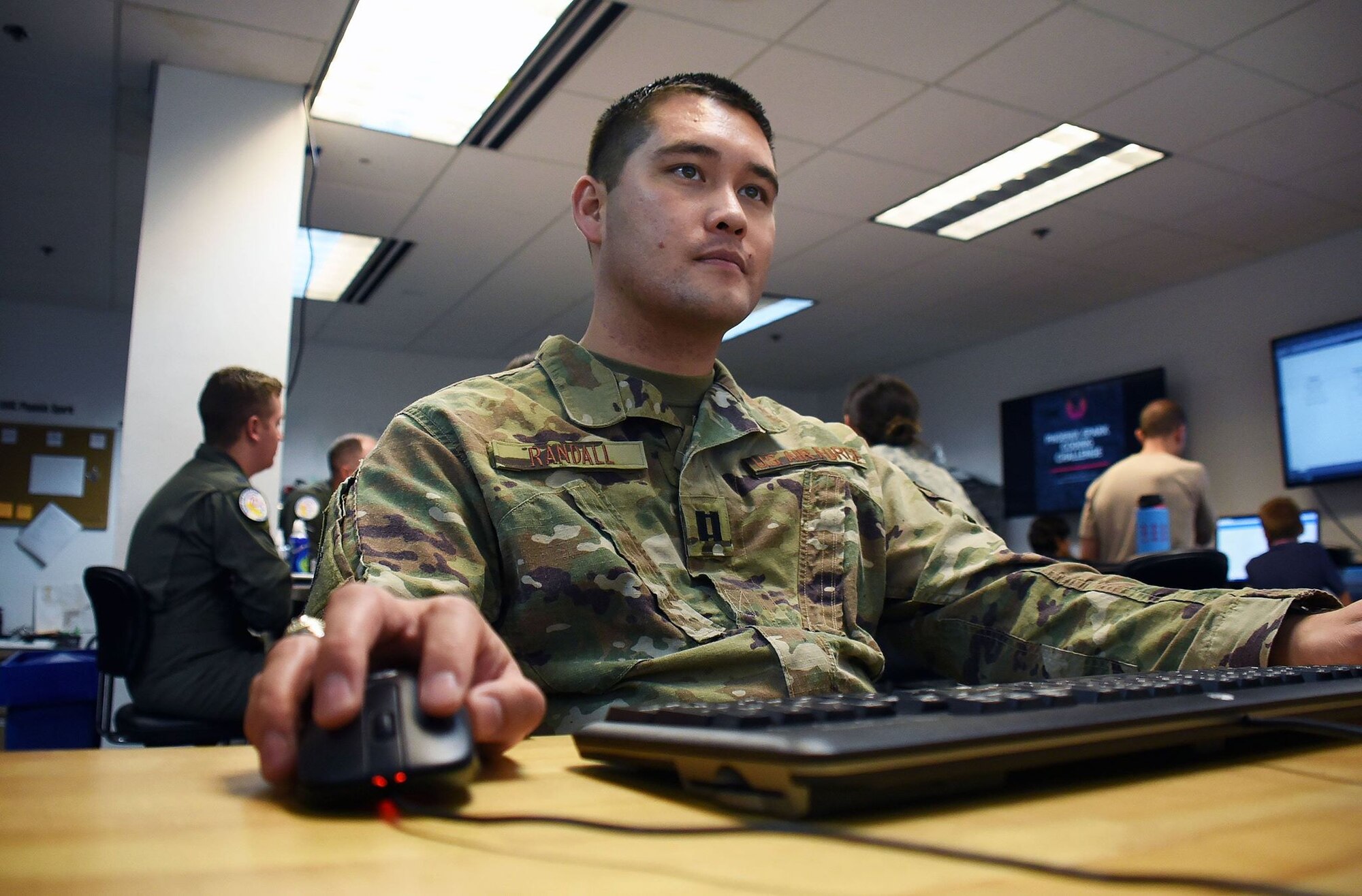 Capt. Derek Randall, 60th Operations Support Squadron officer in charge of intelligence analysis, participates in a coding challenge hosted by Travis Air Force Base, Calif.'s Phoenix Spark innovation team Oct. 26. Randall's expertise shone through during the challenge leading him to call the challenges, "fairly simple." (U.S. Air Force photo by Airman 1st Class Jonathon D.A. Carnell)