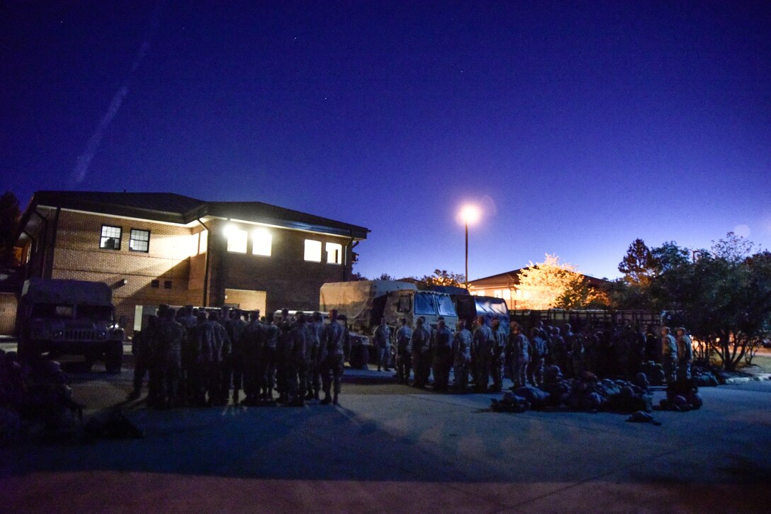 U.S. Army Soldiers in the 1098th Transportation Company, 11th Transportation Battalion, 7th Transportation Brigade (Expeditionary), stand in formation for accountability at the start of emergency deployment readiness exercise at Joint Base Langley-Eustis, Virginia, Oct. 22, 2018.