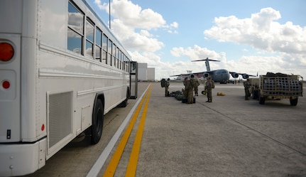 Deployers from Headquarters Company, 89th Military Police Brigade, await transportation to Joint Base San Antonio-Lackland in support of Operation Faithful Patriot Oct. 29. The C-17 Globemaster III and C-130 aircrews provided strategic airlift to Headquarters Company, 89th Military Police Brigade, who are deploying Soldiers, equipment and resources to assist the Department of Homeland Security along the southwest border.