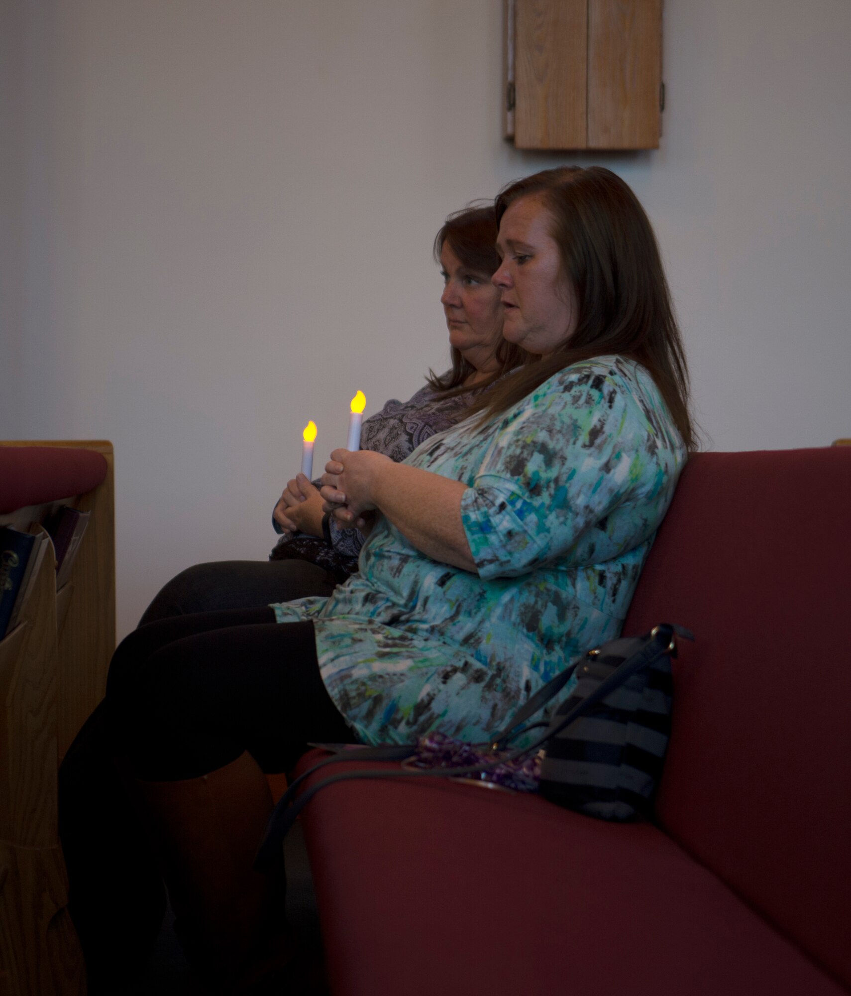 Team Shaw members honor those who have passed due to domestic violence during a candlelight vigil at Shaw Air Force Base, S.C., Oct. 30, 2018.