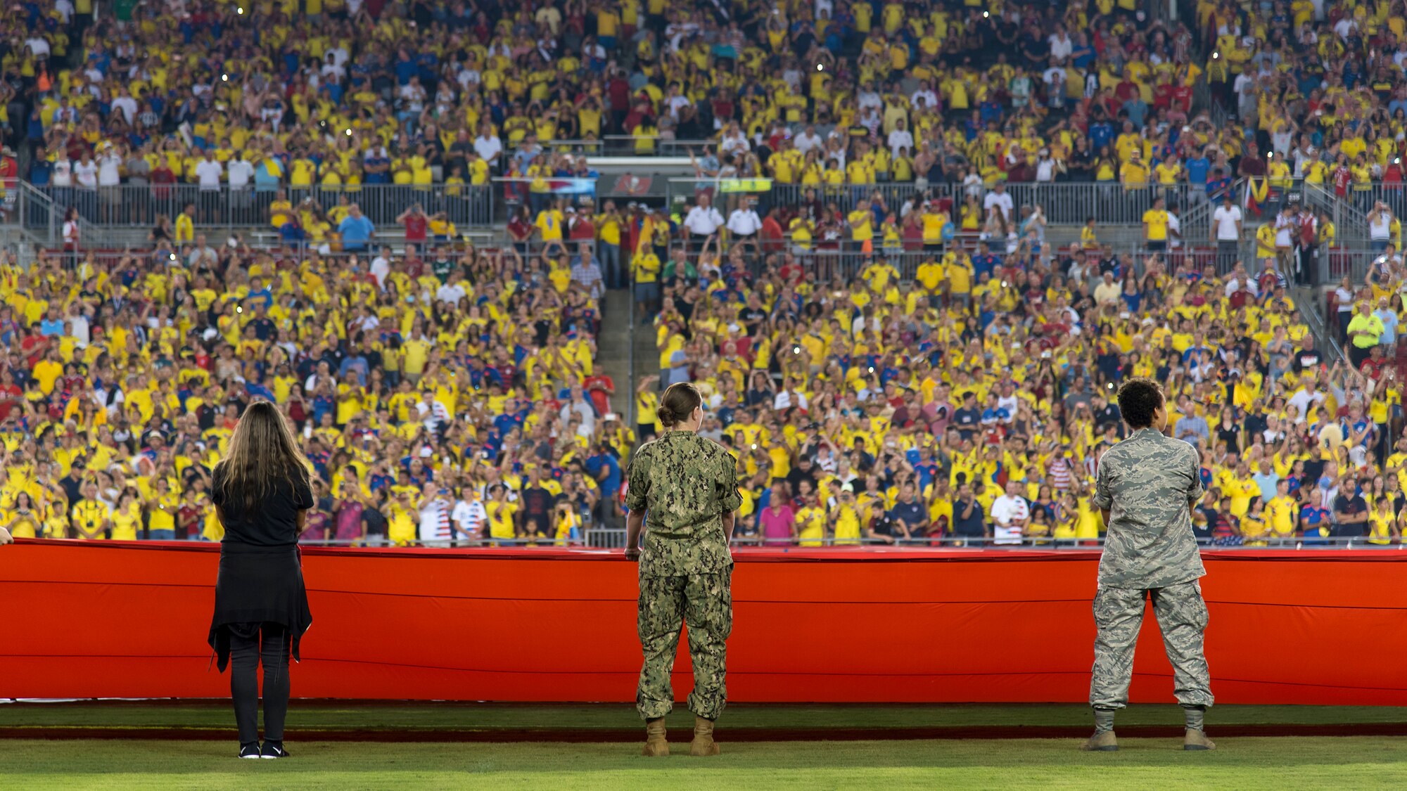 Around 100 military members and their families participate in a flag presentation ceremony before an exhibition match between the U.S. Soccer Men’s National Team and the Colombian National Team at Raymond James Stadium, Tampa, Fla., Oct. 11, 2018.  The USMNT provides military members the opportunity to present the American flag before every game.