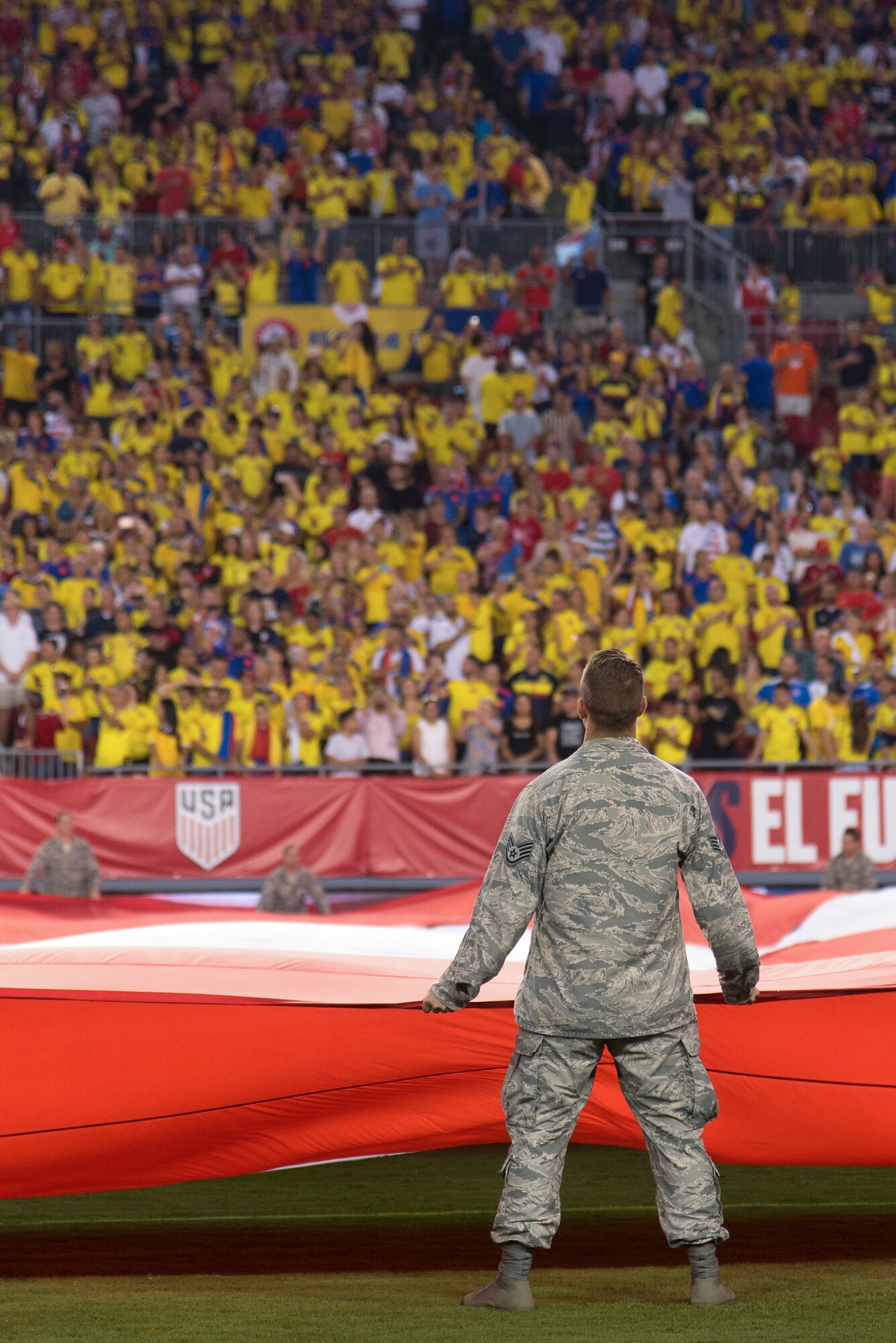 Around 100 military members and their families participate in a flag presentation ceremony before an exhibition match between the U.S. Soccer Men’s National Team and the Colombian National Team at Raymond James Stadium, Tampa, Fla., Oct. 11, 2018.  The USMNT provides military members the opportunity to present the American flag before every game.