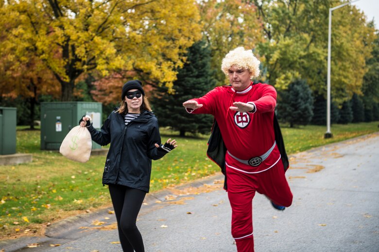 Stacey Pennington, Grissom's family readiness consultant, and Tech. Sgt. Daniel Huff, 434th Force Support Squadron family readiness technician, pose for the camera as they complete the Halloween 5K event at Grissom Air Reserve Base, Ind., Oct. 31, 2018. Over a dozen runners participated, and attendees were encouraged to run in costume. (U.S. Air Force photo / Senior Airman Harrison Withrow)