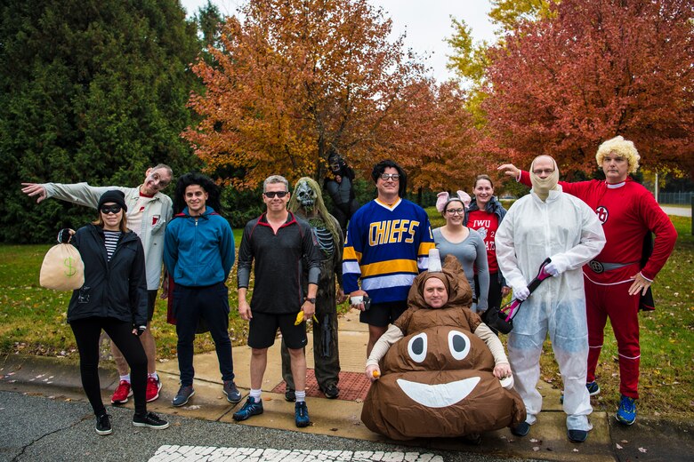 Participants of the Halloween 5K event gather after finishing their run at Grissom Air Reserve Base, Ind., Oct. 31, 2018. Over a dozen runners participated, and attendees were encouraged to run in costume. (U.S. Air Force photo / Senior Airman Harrison Withrow)