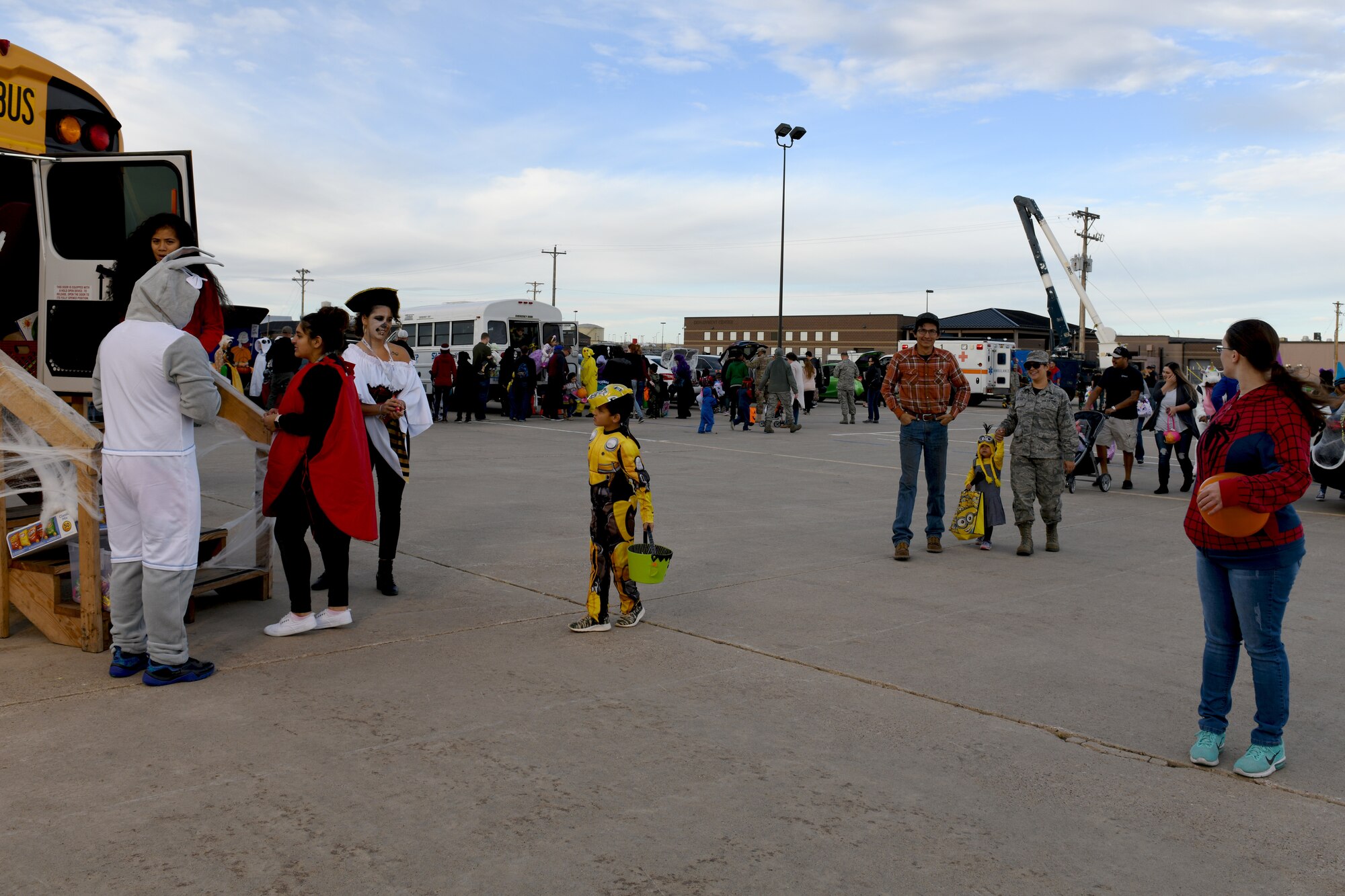 Airman and their families attend a Trunk or Treat event at the Pride Hangar parking lot on Ellsworth Air Force Base, S.D., Oct. 26, 2018. Volunteers from the 28th Bomb Wing decorated their personal and work vehicles with Halloween themes and put them on display. (U.S. Air Force photo by Airman 1st Class Christina Bennett)