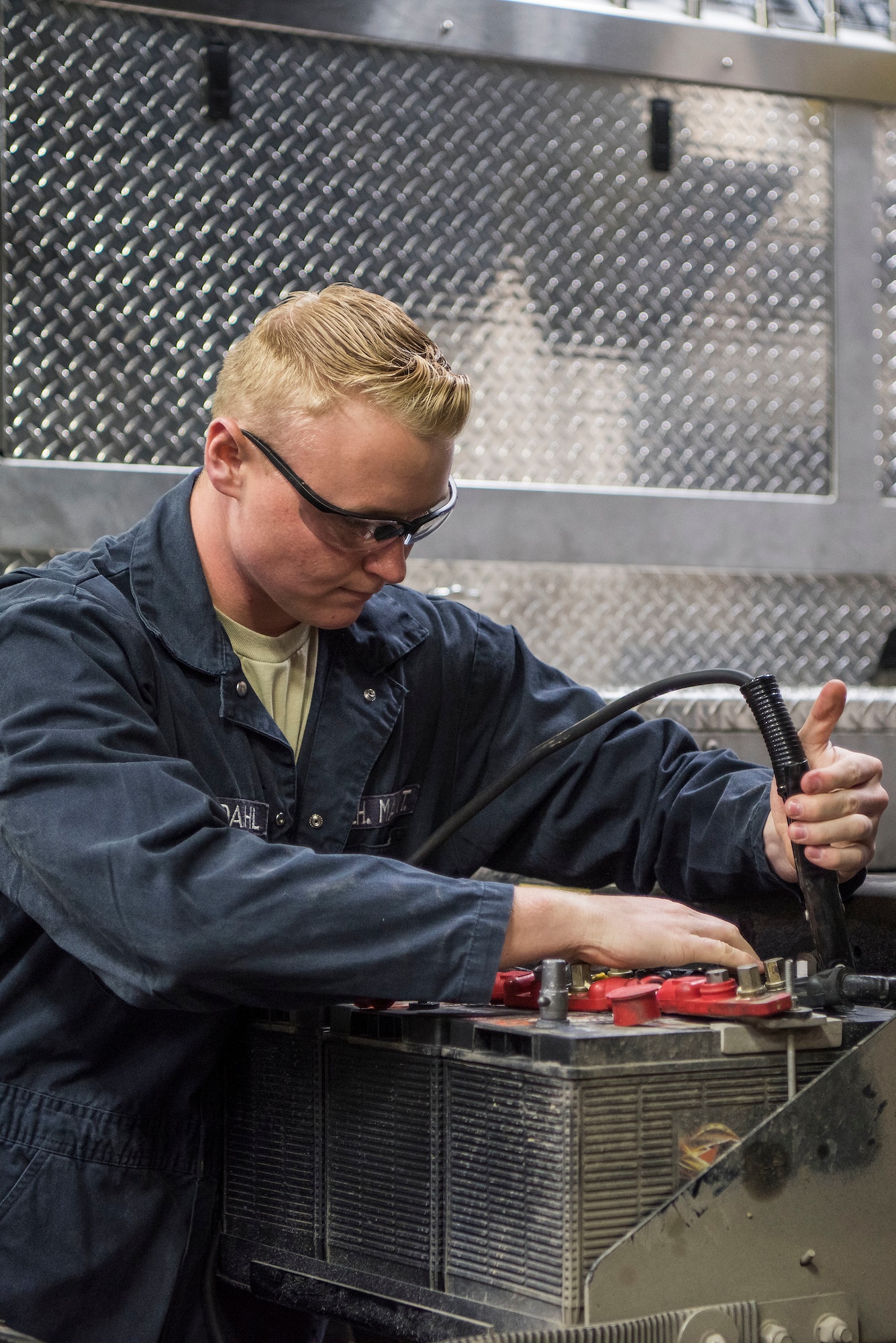 Airman 1st Class Shane Ousdahl, 673d Logistics Readiness Squadron fire truck and refueling mechanic, tests a fire truck battery at Fire Station 1 on Joint Base Elmendorf-Richardson, Alaska, Sep. 17, 2018. Fire truck and refueling mechanics perform daily care on fire trucks while also following monthly and yearly maintenance checklists.
