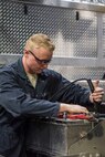 Airman 1st Class Shane Ousdahl, 673d Logistics Readiness Squadron fire truck and refueling mechanic, tests a fire truck battery at Fire Station 1 on Joint Base Elmendorf-Richardson, Alaska, Sep. 17, 2018. Fire truck and refueling mechanics perform daily care on fire trucks while also following monthly and yearly maintenance checklists.