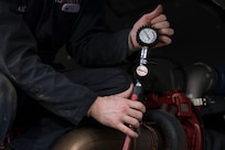 An Airman with the 673d Logistics Readiness Squadron, tests the pressure cooling system during a yearly maintenance review during a yearly maintenance review at Fire Station 1 on Joint Base Elmendorf-Richardson, Alaska, Sep. 17, 2018. Fire truck and refueling mechanics perform daily care on fire trucks while also following monthly and yearly maintenance checklists.