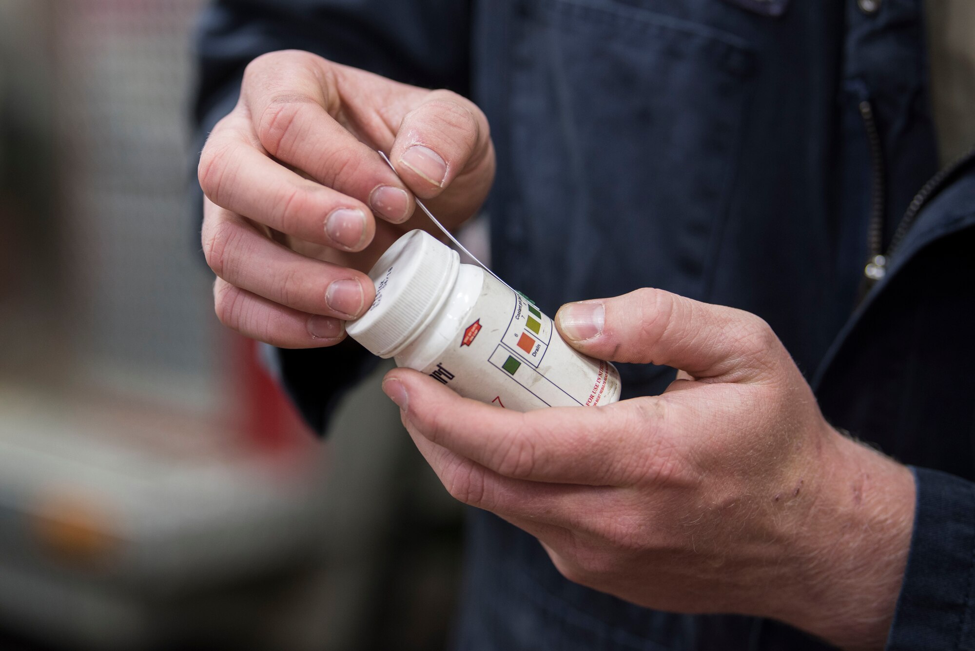 Airman 1st Class Shane Ousdahl, 673d Logistics Readiness Squadron fire truck and refueling mechanic, checks the color saturation of the coolant chemicals during a yearly maintenance review at Fire Station 1 on Joint Base Elmendorf-Richardson, Alaska, Sep. 17, 2018. Fire truck and refueling mechanics perform daily care on fire trucks while also following monthly and yearly maintenance checklists.