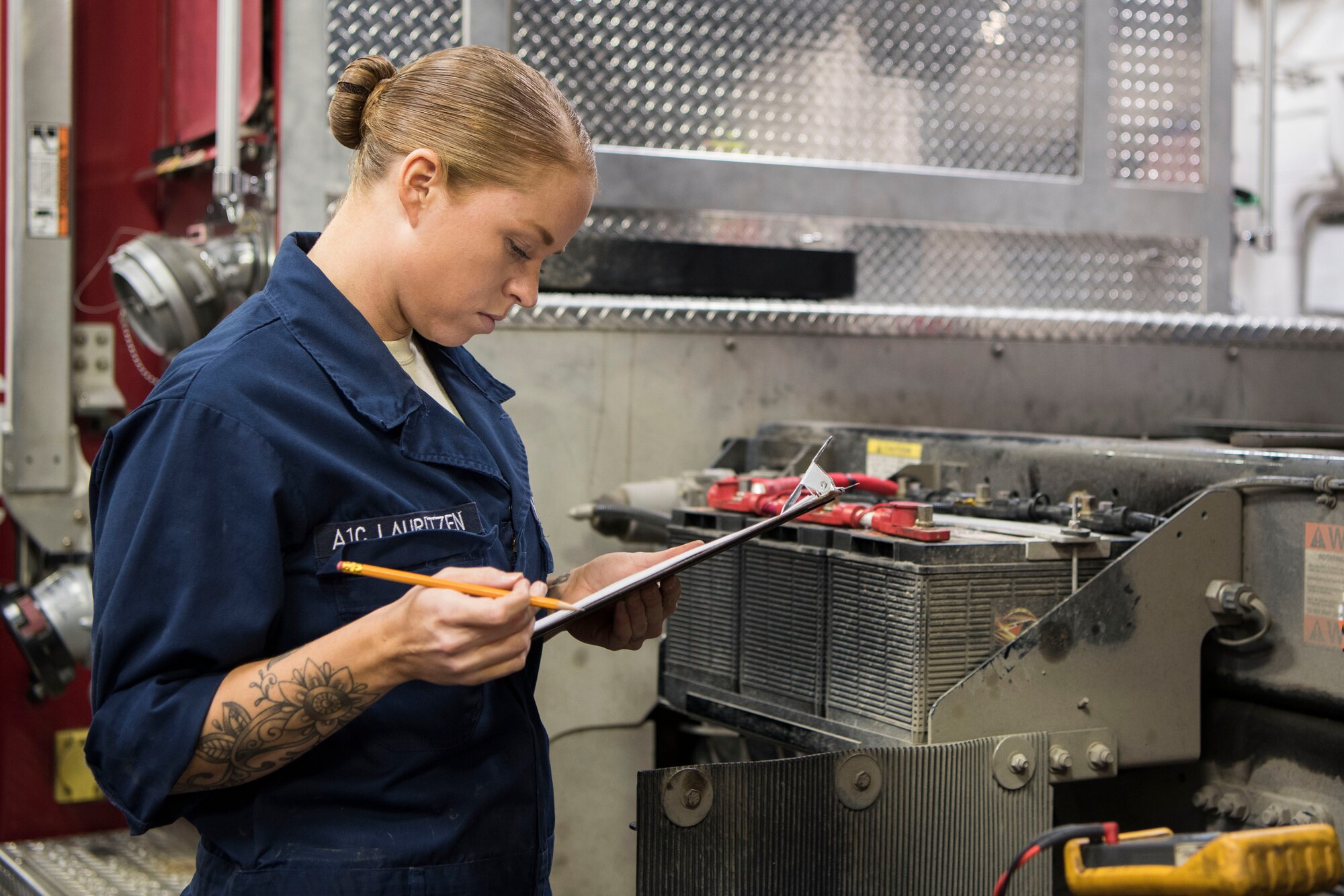 Airman 1st Class LaMonica Lauritzen, 673d Logistics Readiness Squadron fire truck and refueling mechanic, reviews the annual fire truck maintenance checklist at Fire Station 1 on Joint Base Elmendorf-Richardson, Alaska, Sep. 17, 2018. Fire truck and refueling mechanics perform daily care on fire trucks while also following monthly and yearly maintenance checklists.