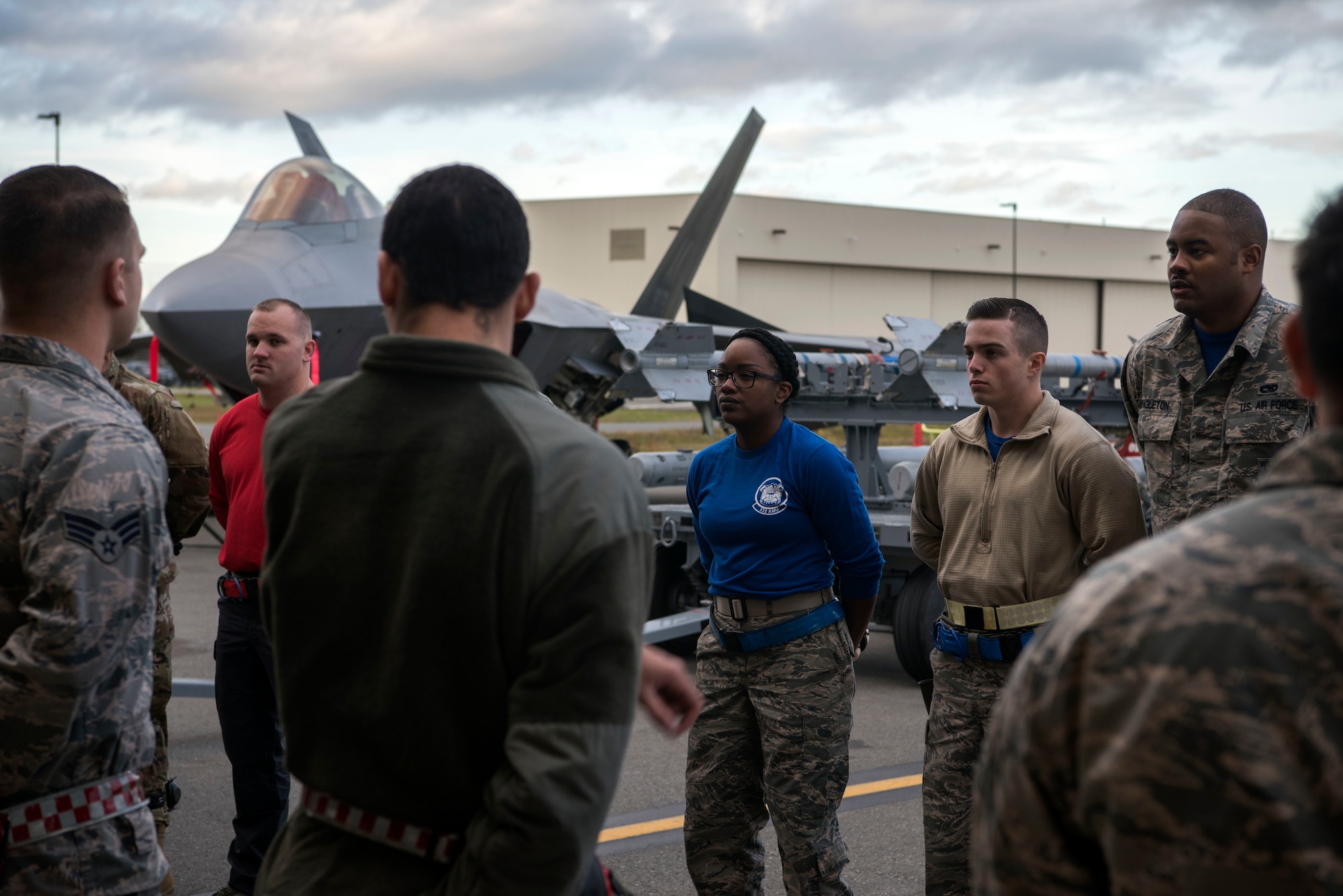 Service members from the 525th and 90th aircraft maintenance units prepare for the quarterly load competition at Joint Base Elmendorf-Richardson, Alaska, Oct. 26, 2018. During the competition, two teams tested their skills as load crew members for the F-22 Raptor. The event demonstrates the skill level and knowledge of all JBER aircraft maintainers.