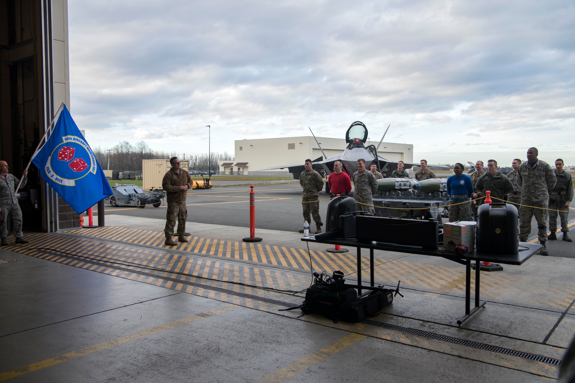 U.S. Air Force Chief Master Sgt. Paul Nightingale, 3rd Maintenance Group wing weapons manager, gives a speech prior to the quarterly load competition at Joint Base Elmendorf-Richardson, Alaska, Oct. 26, 2018. During the competition, Airmen from the 525th and 90th aircraft maintenance units tested their skills as load crew members for the F-22 Raptor. The event demonstrates the skill level and knowledge of all JBER aircraft maintainers.