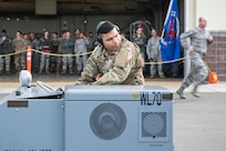 U.S. Air Force Airman 1st Class Anthony Lewis, a 90th Aircraft Maintenance Unit weapons load crew member, drives a jammer during the quarterly load competition at Joint Base Elmendorf-Richardson, Alaska, Oct. 26, 2018. The jammer was used to move the GBU-32 Joint Direct Attack Munition (JDAM). The JDAM is used for accurate, adverse weather conventional strikes and weighs approximately 1,000 lbs.