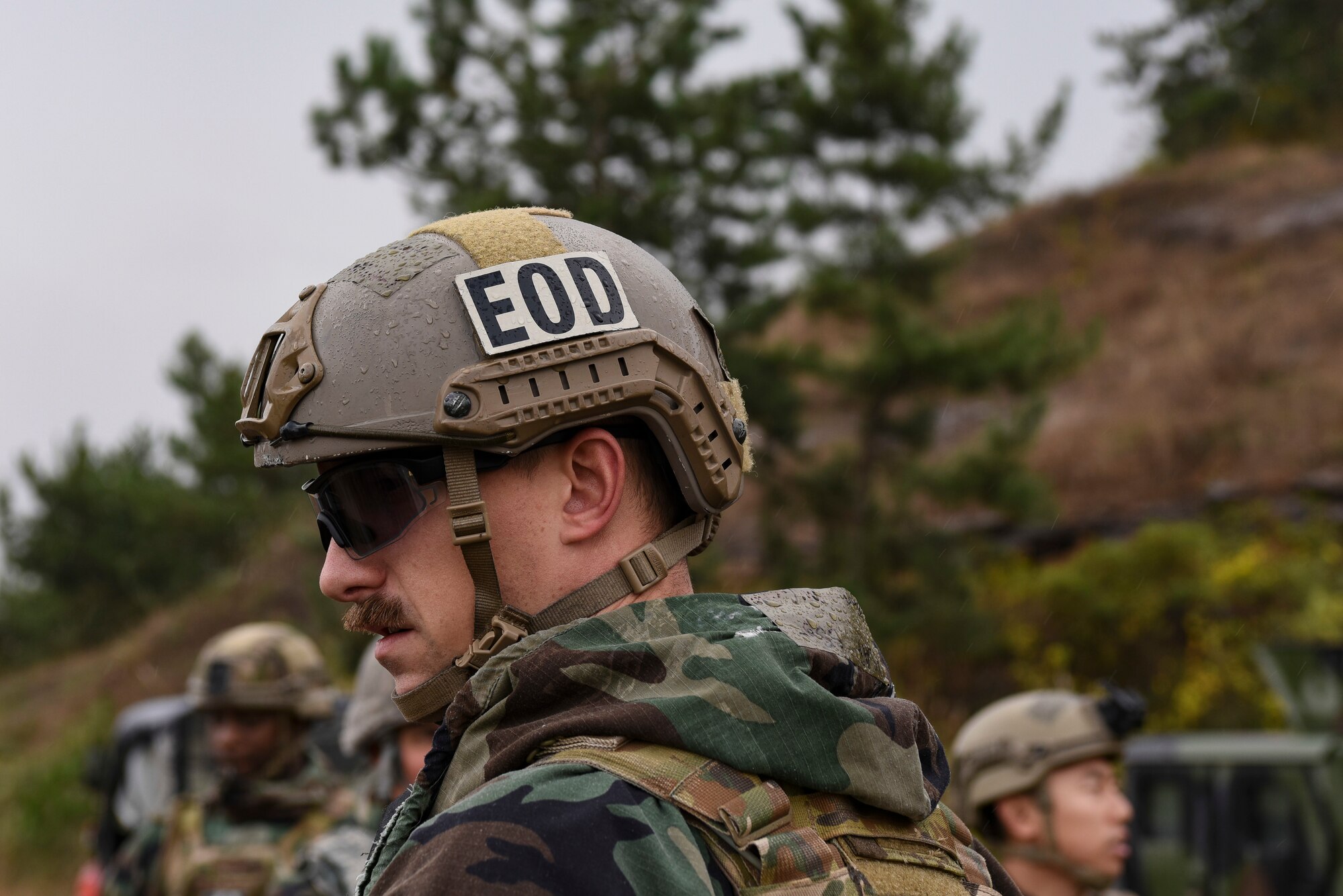 An Explosive Ordnance Disposal Airman from the 8th Civil Engineer Squadron participates in demolition training with an EOD team at Kunsan Air Base, Republic of Korea, Oct. 29, 2018. EOD members are trained to detect, disarm, detonate and dispose of explosive threats all over the world. During the training, EOD detonated multiple charges similar to the ones used to blast open a locked door.  (U.S. Air Force photo by Senior Airman Savannah Waters)